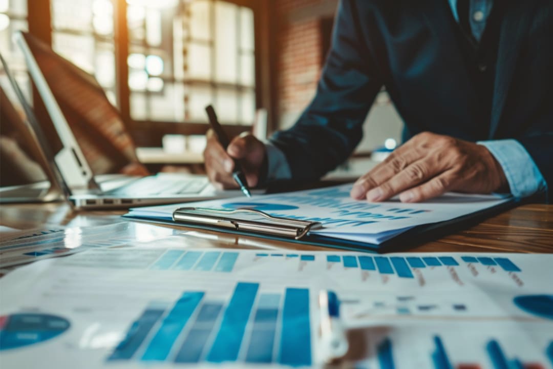 Sales professional reviewing performance reports and growth data
